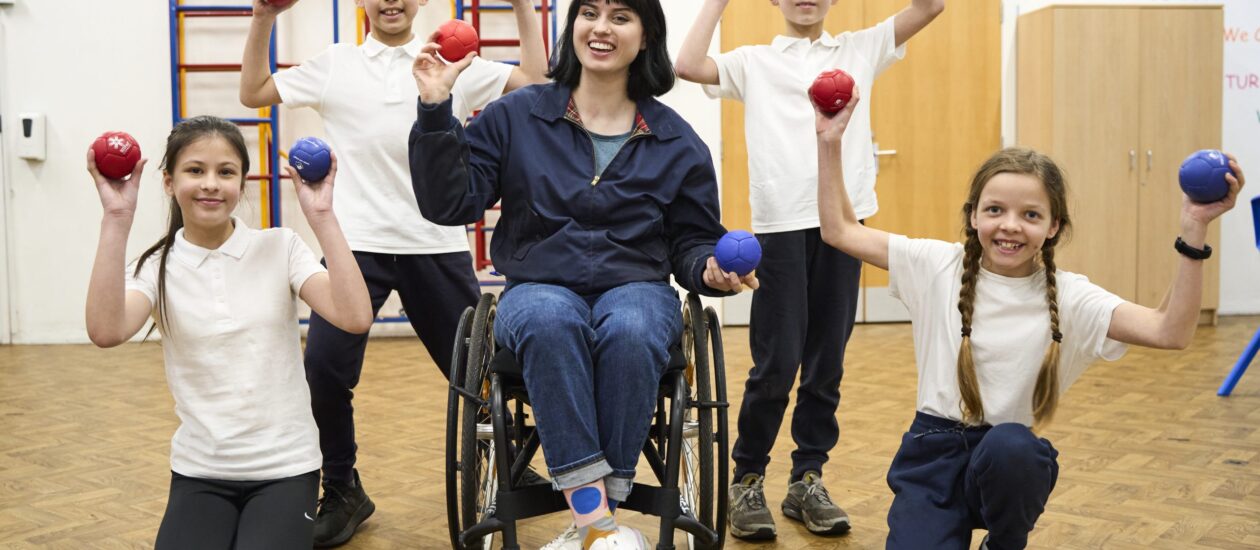 Super Movers 2024- Group holding boccia balls with Abby Cook